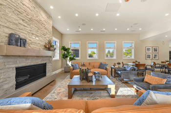 Clubhouse lounge with fireplace and seating area